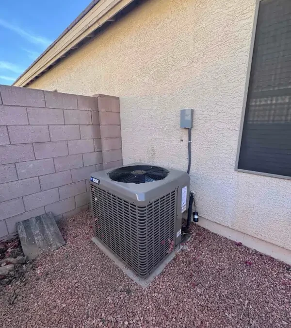 Residential outdoor AC condenser unit installation by Falcon Air Conditioning, providing air conditioning and heating services in Mesa, Arizona.